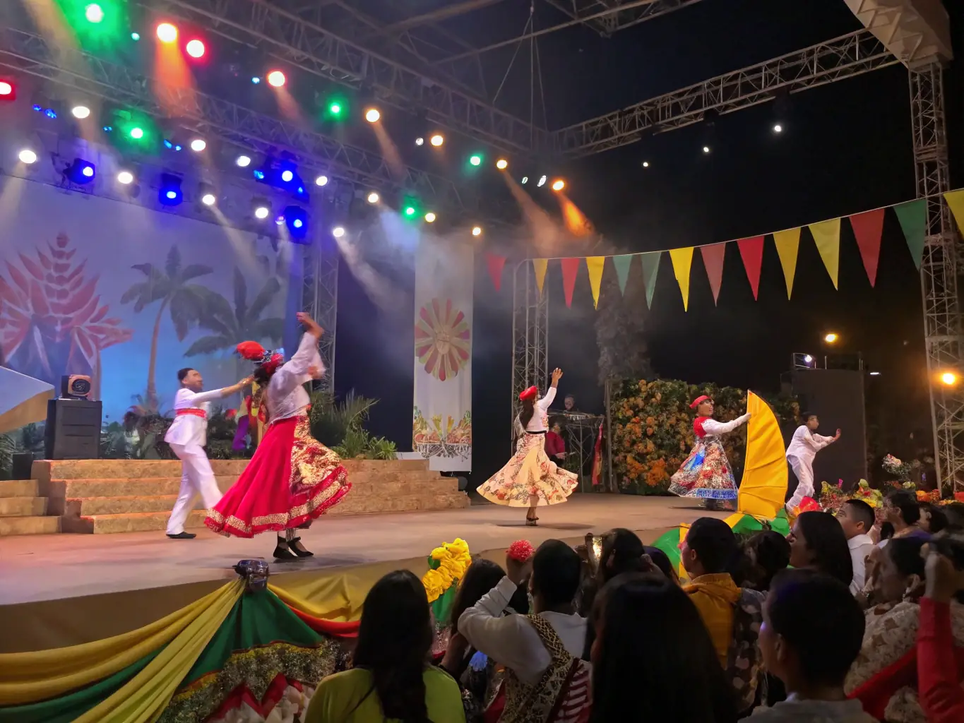 A vibrant stage scene with performers during an ELIXION-organized community show, showcasing local talent and cultural expression.